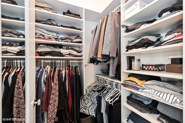 650 West Fulton Street, Unit B Chicago, IL 60661 - Photo 17 of 34 a view of walk in closet with clothes and shoes