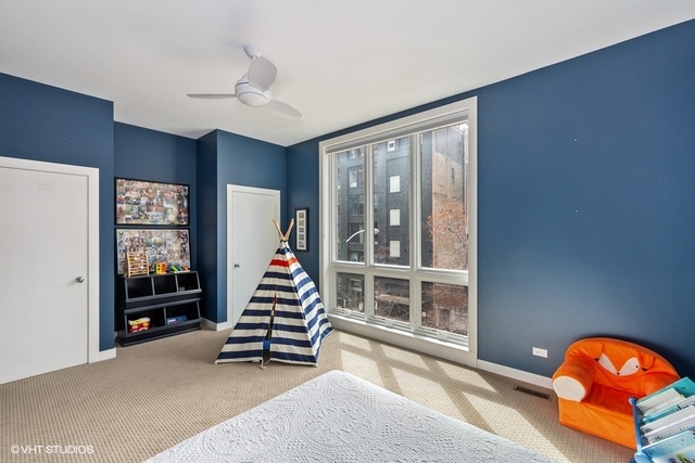 650 West Fulton Street, Unit B Chicago, IL 60661 - Photo 19 of 34 a living room with wooden floor and white walls