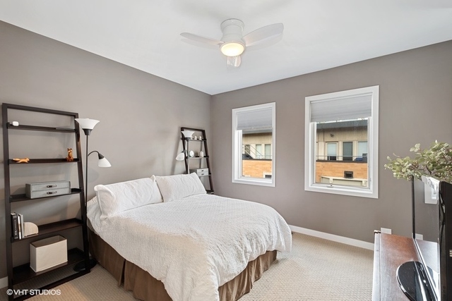 650 West Fulton Street, Unit B Chicago, IL 60661 - Photo 20 of 34 a bedroom with a bed and a window