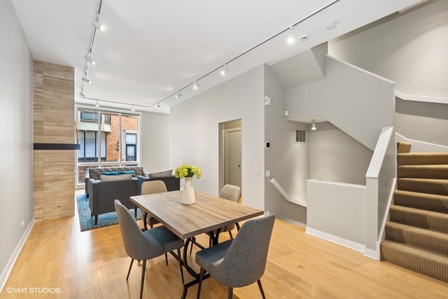650 West Fulton Street, Unit B Chicago, IL 60661 - Photo 3 of 34 a view of a dining room with furniture and wooden floor