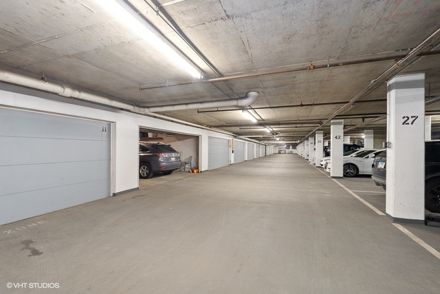 650 West Fulton Street, Unit B Chicago, IL 60661 - Photo 27 of 34 a view of parking garage with cars