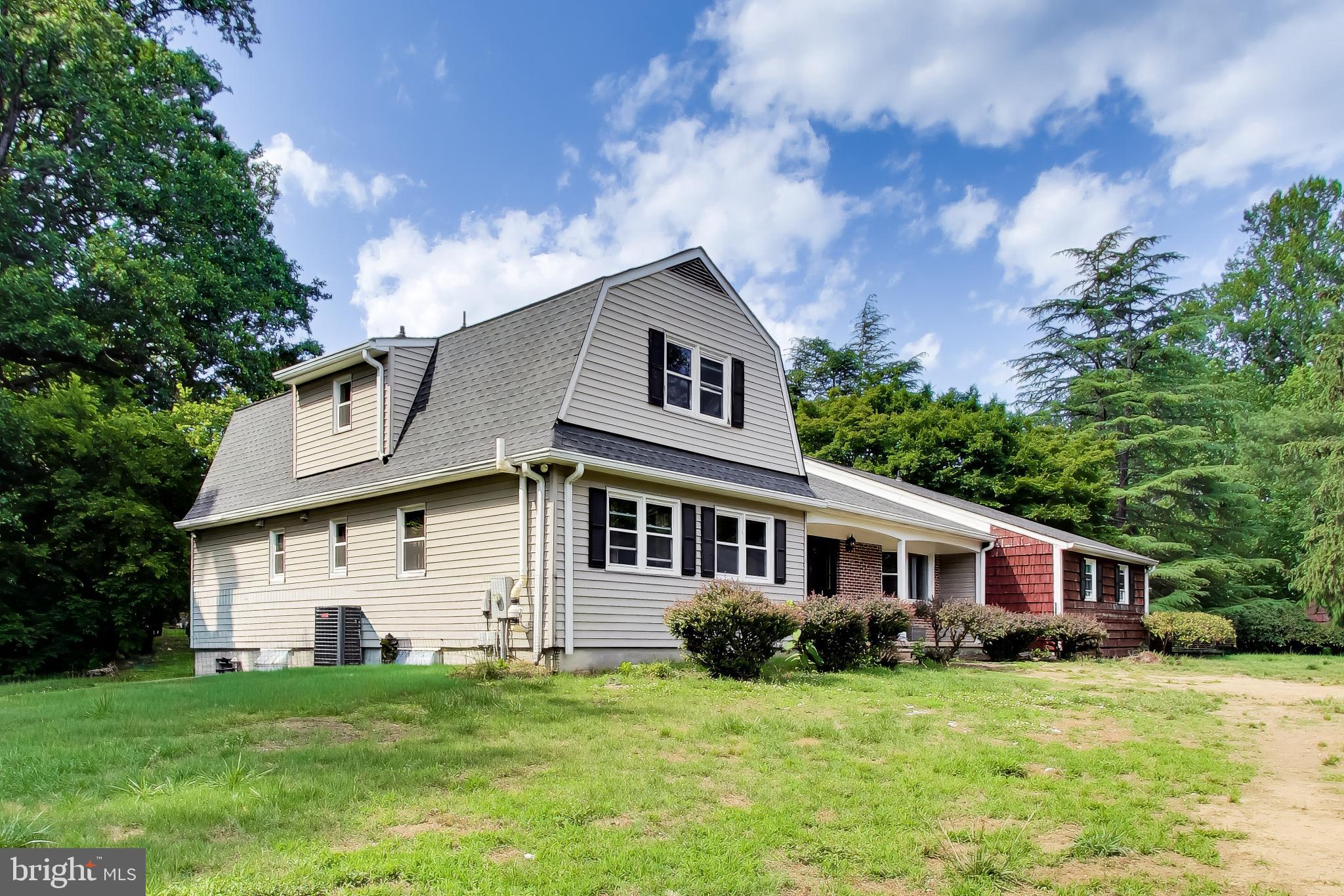 3240 Juniper Lane Huntingtown, MD 20639 - Photo 33 of 48 a front view of a house with a garden