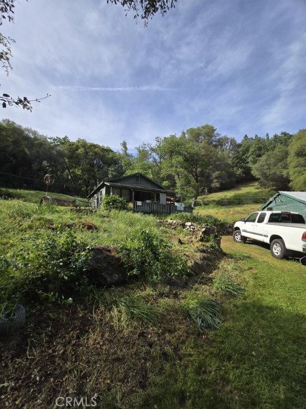 15305 Lake Arthur Road Auburn, CA 95602 - Photo 1 of 11 a garden view with a lake view