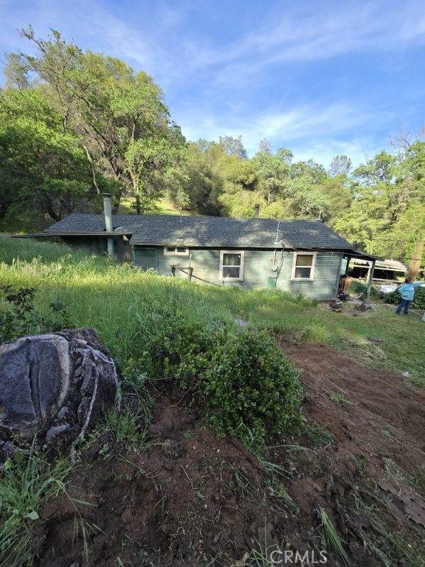 15305 Lake Arthur Road Auburn, CA 95602 - Photo 2 of 11 a view of a yard with a house in the background