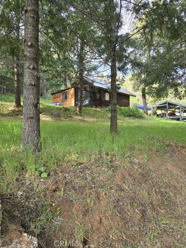 15305 Lake Arthur Road Auburn, CA 95602 - Photo 3 of 11 a view of a house with a yard