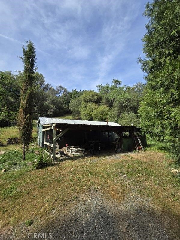 15305 Lake Arthur Road Auburn, CA 95602 - Photo 6 of 11 a view of outdoor space with swimming pool and trees