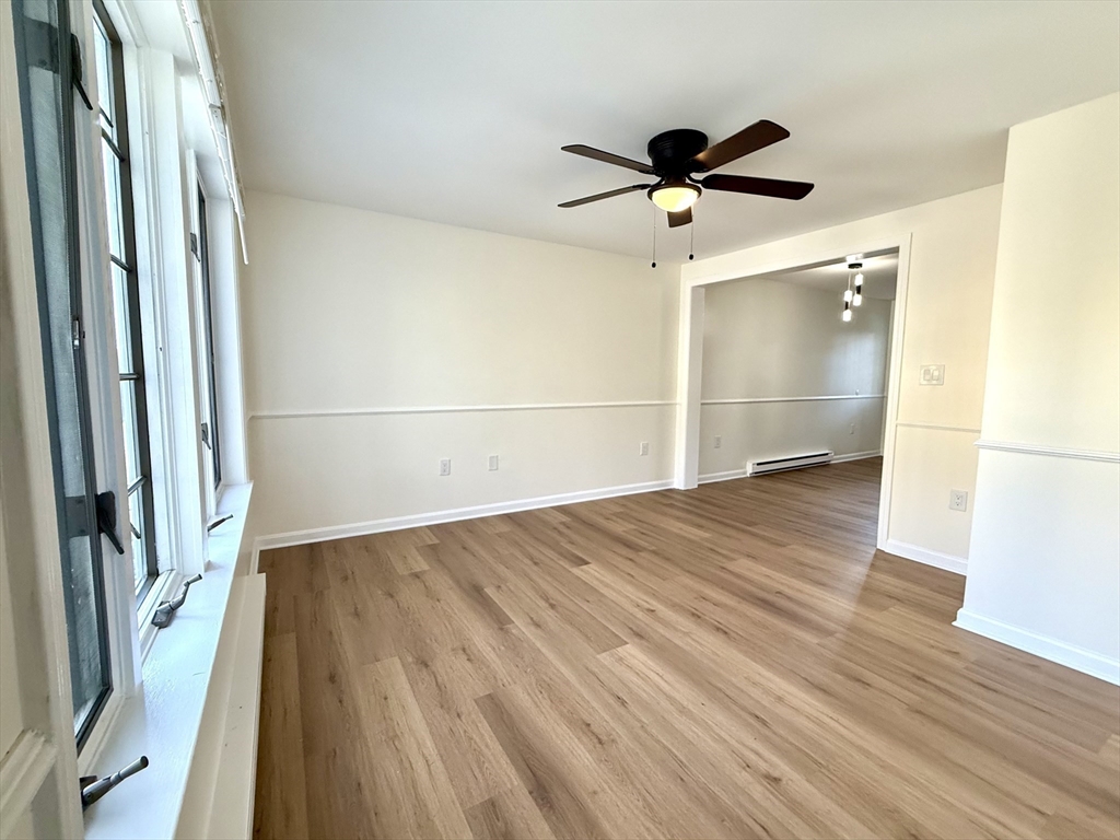 9 Olga Avenue, Unit 9 Worcester, MA 01605 - Photo 11 of 24 a view of empty room with wooden floor