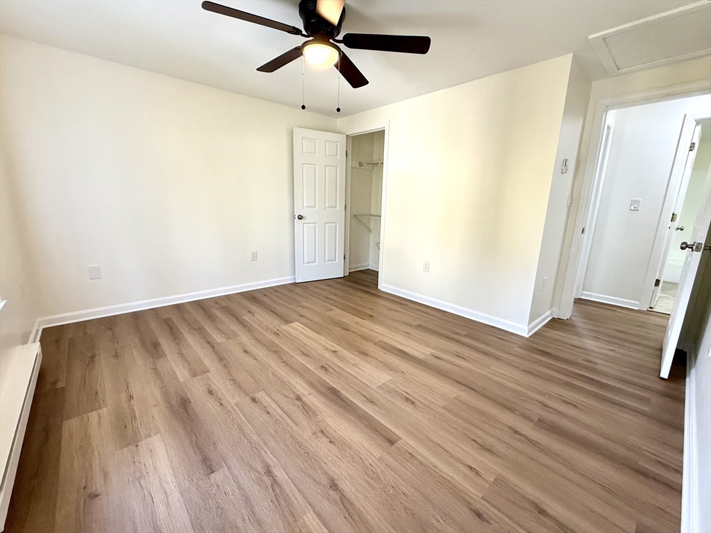 9 Olga Avenue, Unit 9 Worcester, MA 01605 - Photo 15 of 24 an empty room with wooden floor and windows