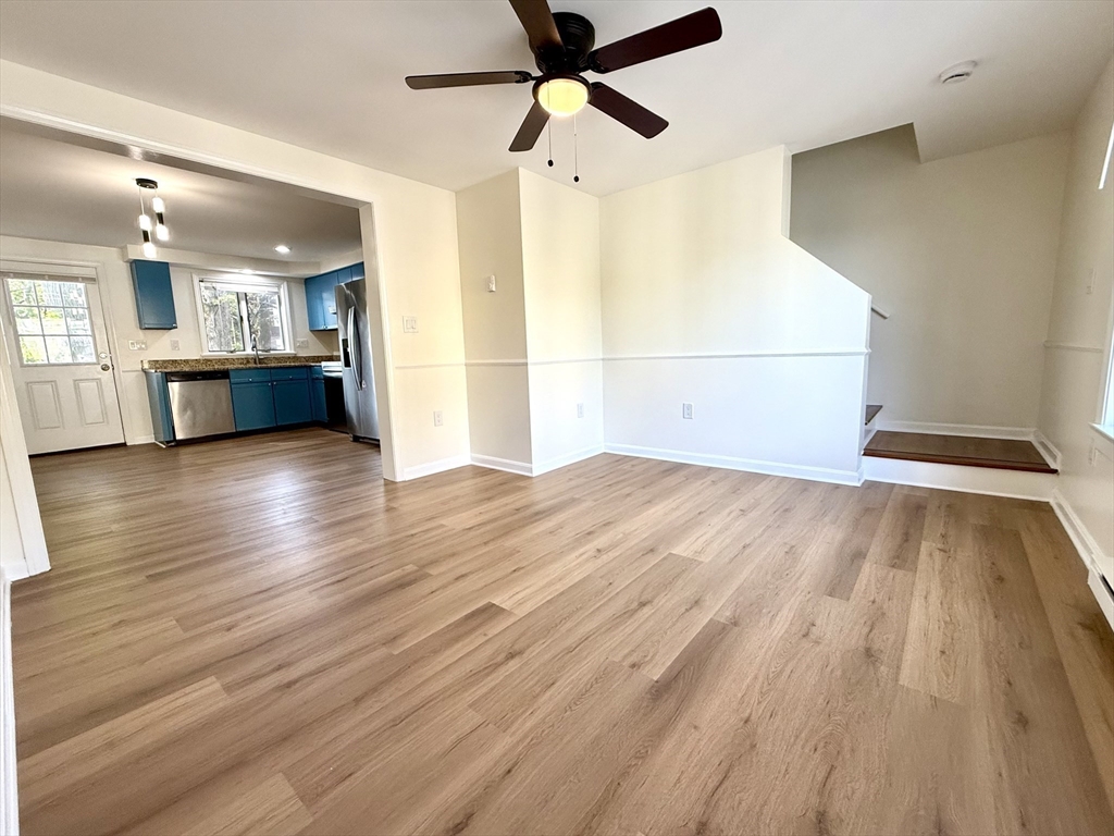 9 Olga Avenue, Unit 9 Worcester, MA 01605 - Photo 9 of 24 a view of a kitchen with wooden floor and a sink