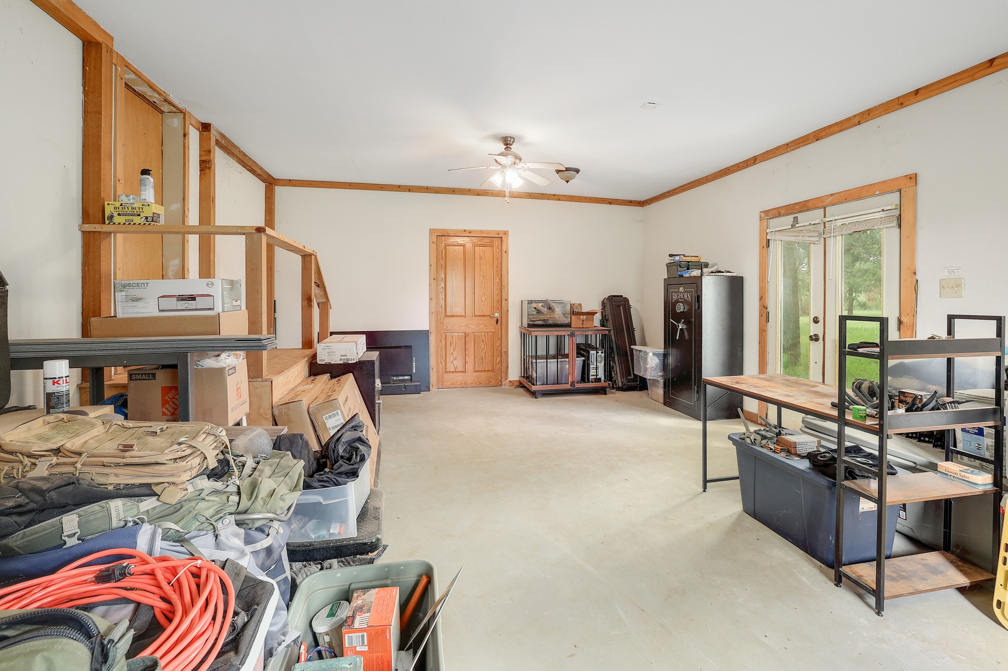 288 The Forest Road Dale, TX 78616 - Photo 22 of 31 a living room with furniture a chandelier and painting on the wall