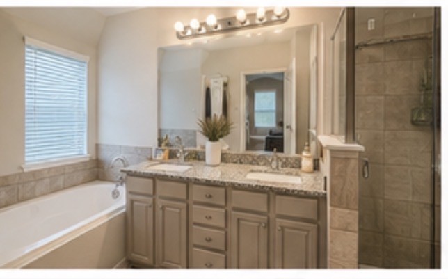 16863 Big Reed Drive Humble, TX 77346 - Photo 7 of 12 : Primary bathroom with dual sinks, soaking tub, and generous counter space