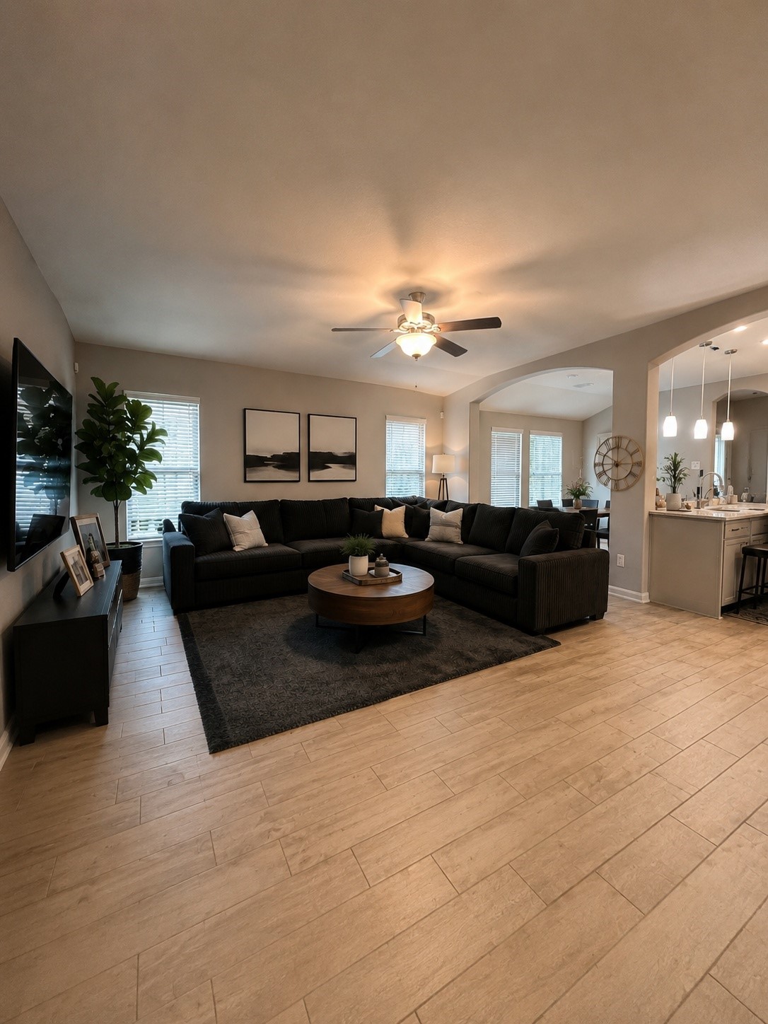 16863 Big Reed Drive Humble, TX 77346 - Photo 8 of 12 Expansive living room with open layout, oversized sectional space, and abundant natural light.