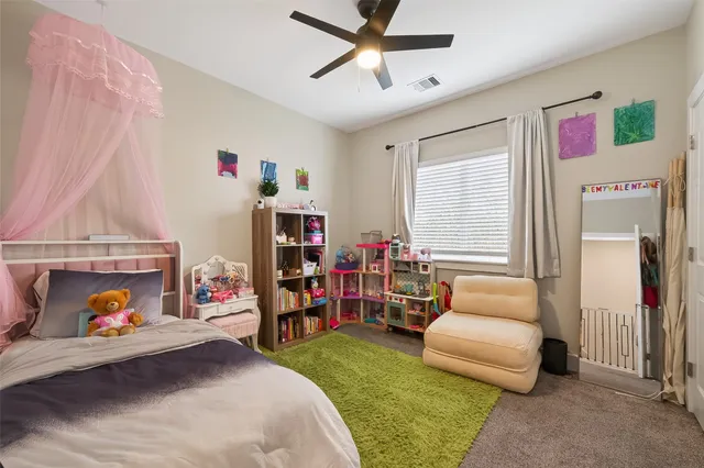 a bed room with a bed and a couch