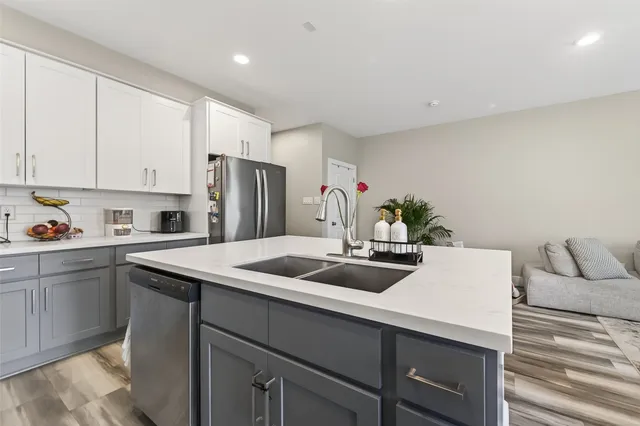 a kitchen with a sink and cabinets