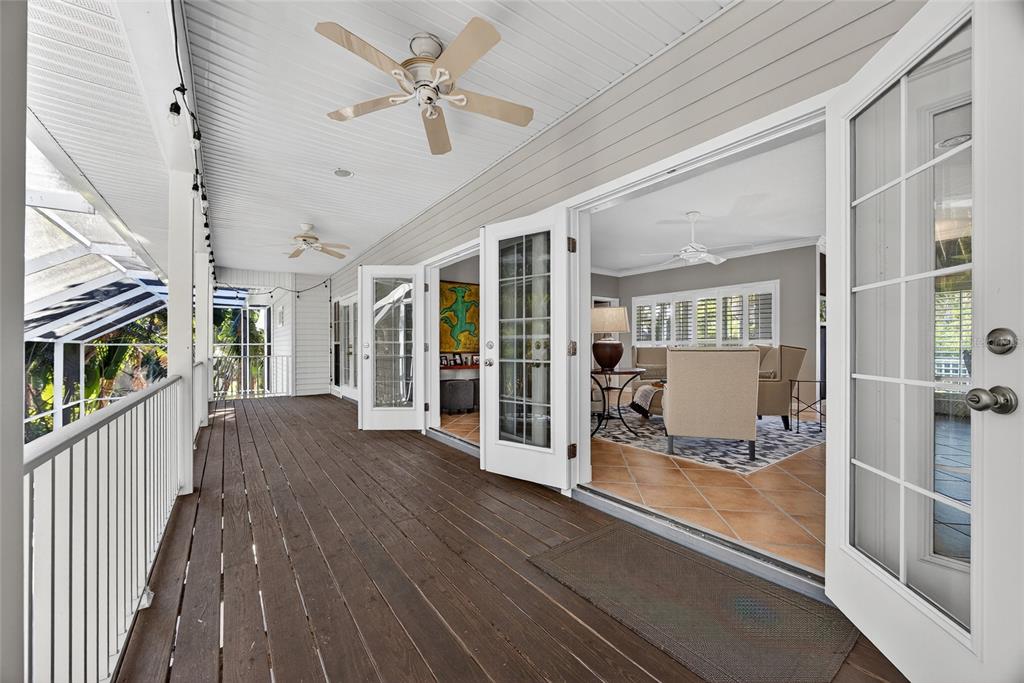116 Dolly Street Punta Gorda, FL 33950 - Photo 13 of 60 a view of a living room with hardwood floor and a ceiling fan