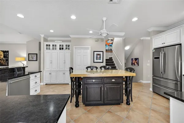 a kitchen with lots of counter top space and dining table