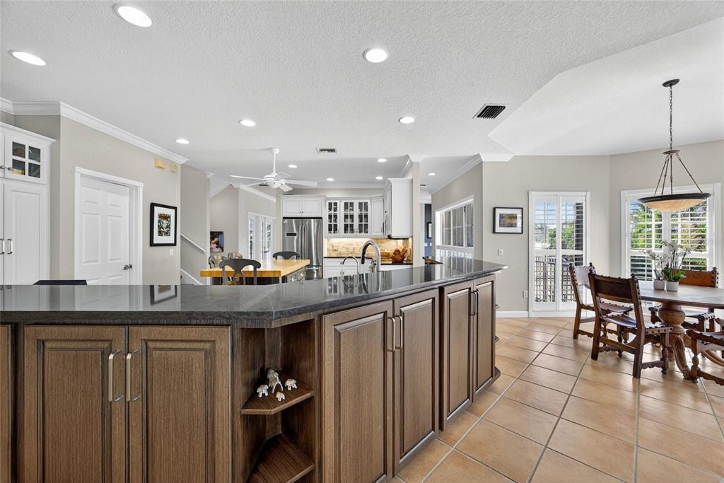 116 Dolly Street Punta Gorda, FL 33950 - Photo 19 of 60 a kitchen with counter space cabinets and dining table