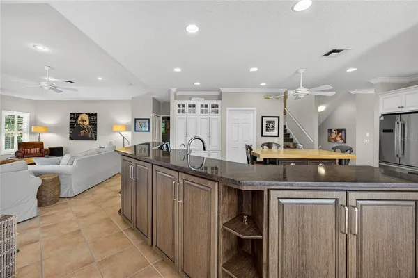 a kitchen with stainless steel appliances a sink stove and microwave