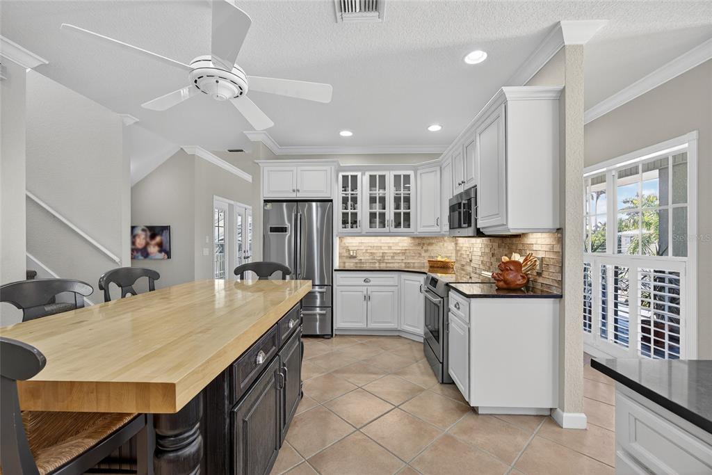 116 Dolly Street Punta Gorda, FL 33950 - Photo 21 of 60 a kitchen with a stove a refrigerator and a sink