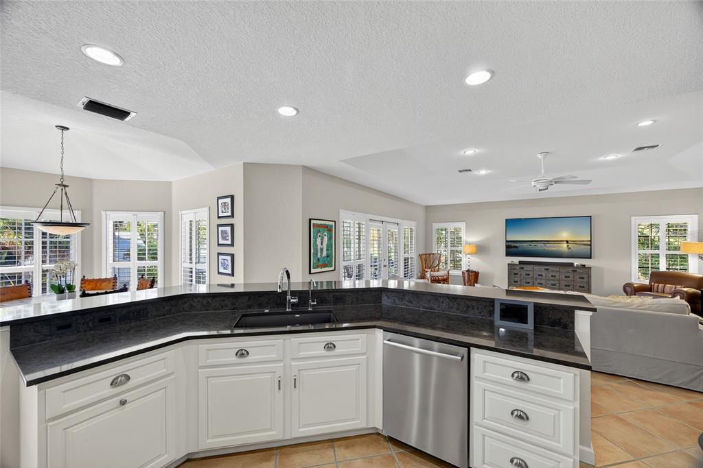 116 Dolly Street Punta Gorda, FL 33950 - Photo 22 of 60 a kitchen with stainless steel appliances a sink stove and microwave
