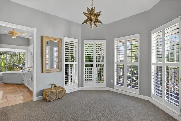 a view of a livingroom with furniture and a window