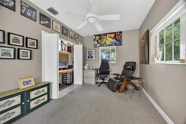 a workspace with furniture and a book shelf
