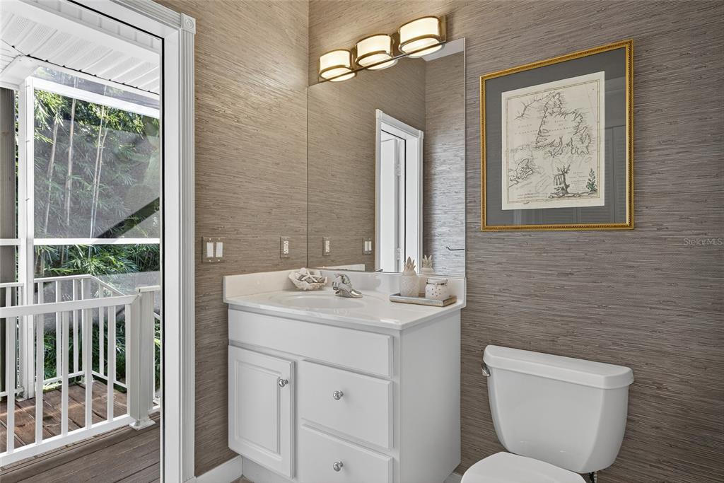 116 Dolly Street Punta Gorda, FL 33950 - Photo 35 of 60 a bathroom with a toilet sink and mirror