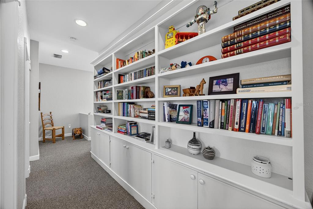 116 Dolly Street Punta Gorda, FL 33950 - Photo 37 of 60 a workspace with furniture and a book shelf