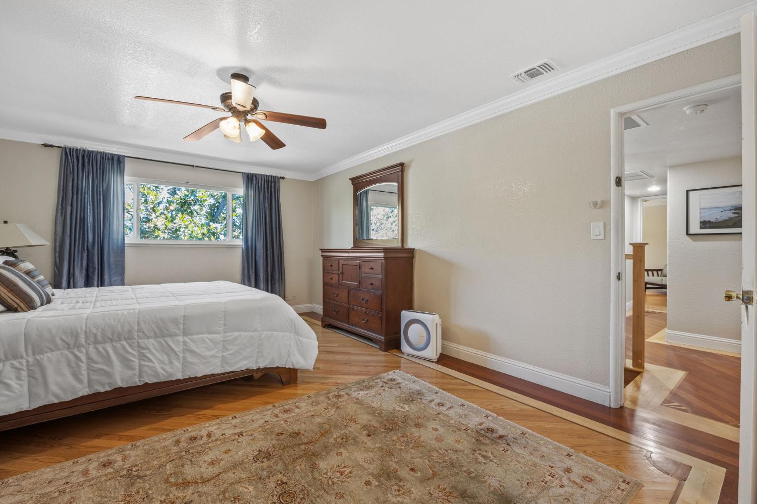 4206 Zephyr Way Sacramento, CA 95821 - Photo 33 of 45 a bedroom with a bed and wooden floor