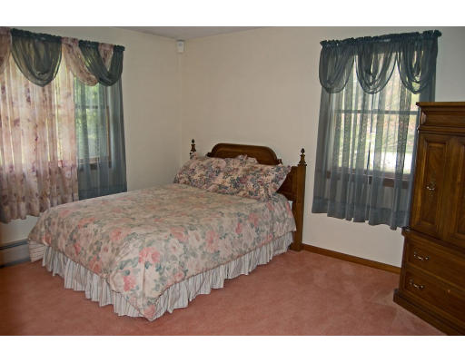 111 Strong Road Southampton, MA 01073 - Photo 11 of 20 a bedroom with a bed and a window