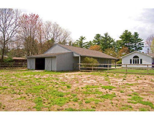 111 Strong Road Southampton, MA 01073 - Photo 17 of 20 a front view of a house with a garden