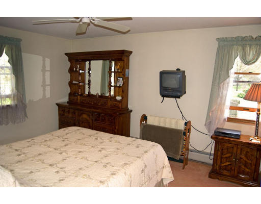 111 Strong Road Southampton, MA 01073 - Photo 10 of 20 a bedroom with a bed and a flat screen tv