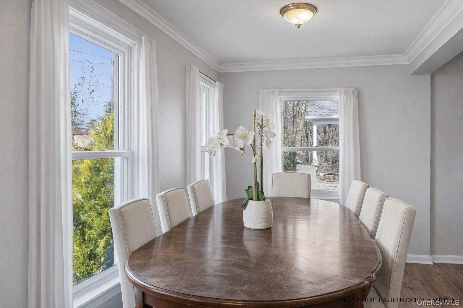 346 Maple Avenue Riverhead, NY 11901 - Photo 2 of 12 a view of a dining room with furniture and wooden floor