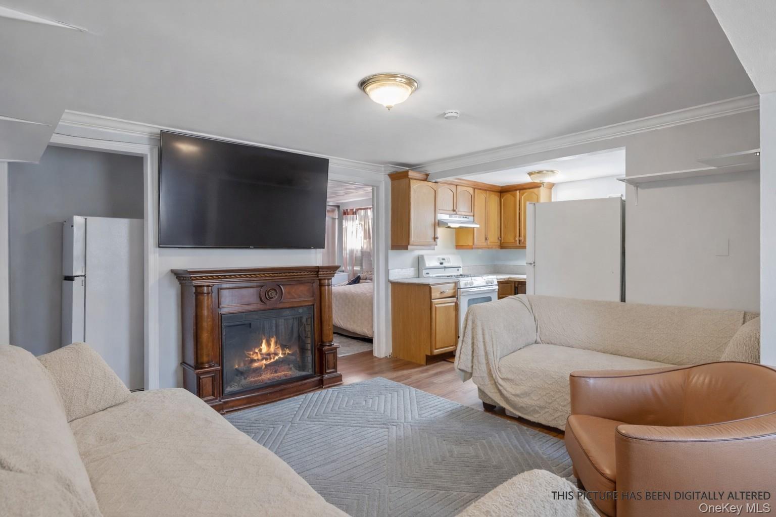 346 Maple Avenue Riverhead, NY 11901 - Photo 5 of 12 a living room with furniture and a fireplace