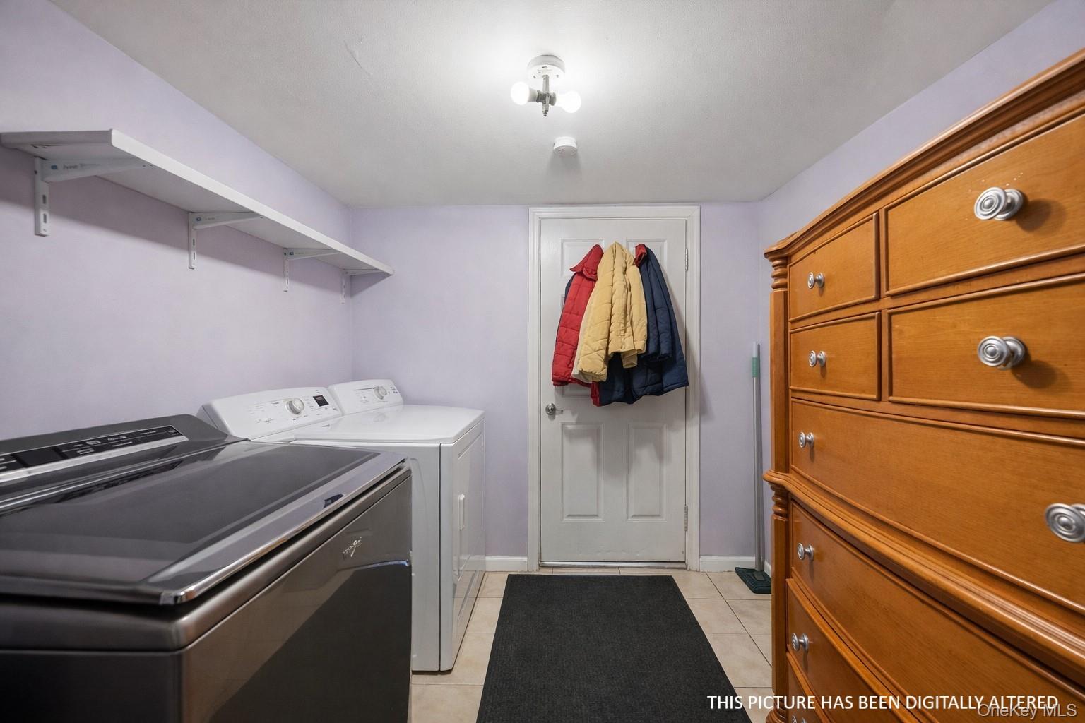 346 Maple Avenue Riverhead, NY 11901 - Photo 8 of 12 a view of walk in closet with clothes and shoes