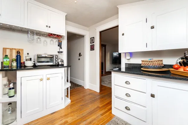 a kitchen with stainless steel appliances a refrigerator and cabinets