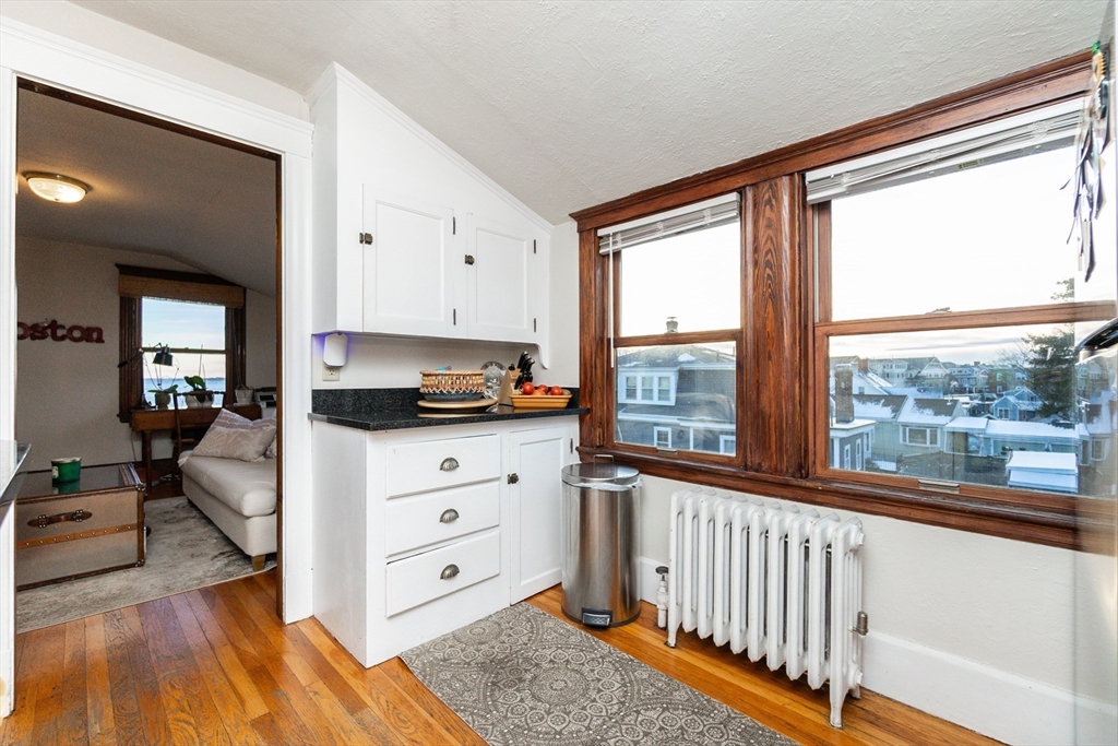 322 Humphrey Street, Unit 1 Swampscott, MA 01907 - Photo 12 of 27 a living room with furniture and a large window