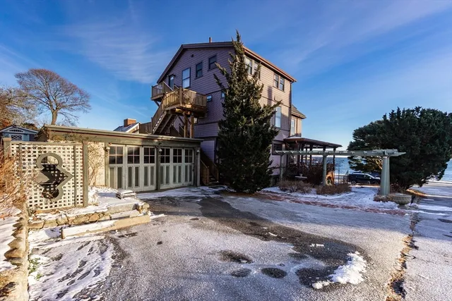 a view of a house with a snow on the road