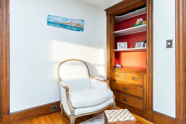 a room with a chair and a window