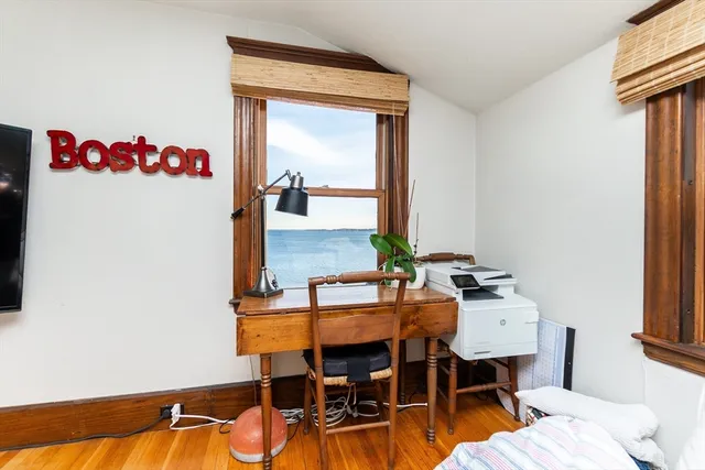 a view of a workspace with furniture