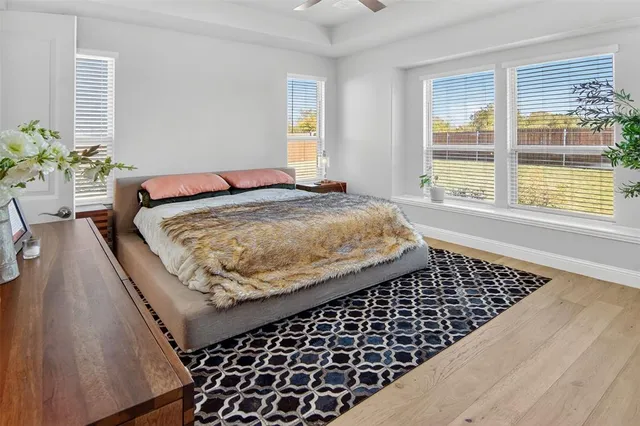 a bedroom with bed and a window