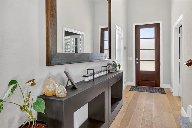 a bathroom with a sink a mirror and a window