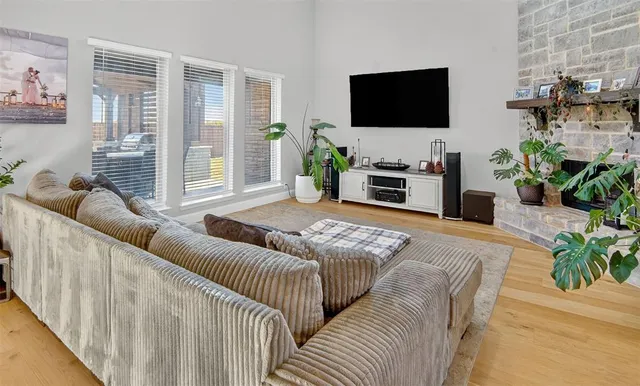 a living room with furniture and a flat screen tv