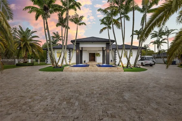 a view of outdoor space with palm trees