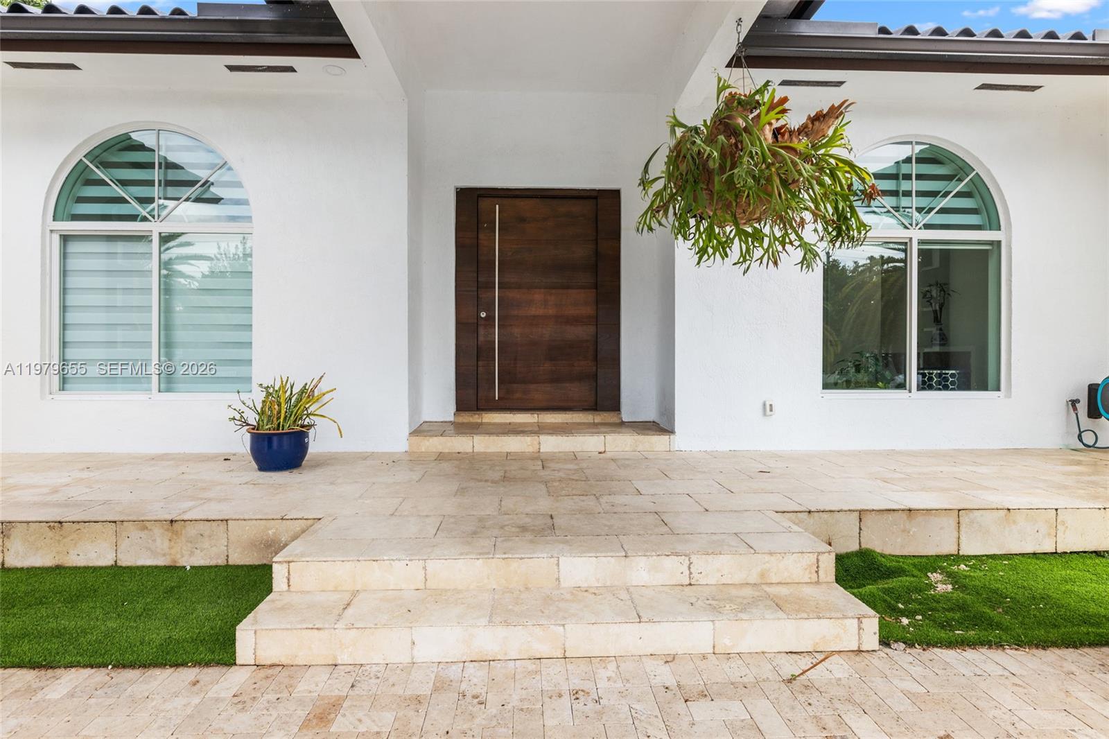 11950 Southwest 43rd Street Miami, FL 33175 - Photo 12 of 78 a front view of a house with garden