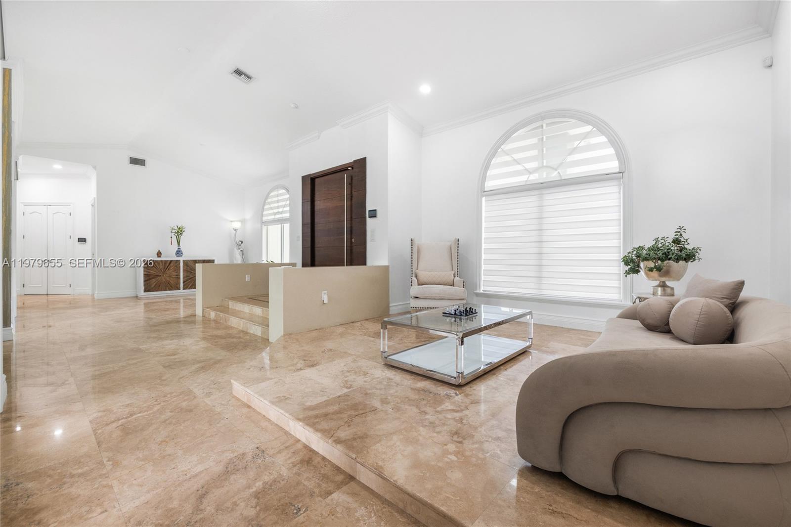 11950 Southwest 43rd Street Miami, FL 33175 - Photo 16 of 78 a living room with furniture and a large window