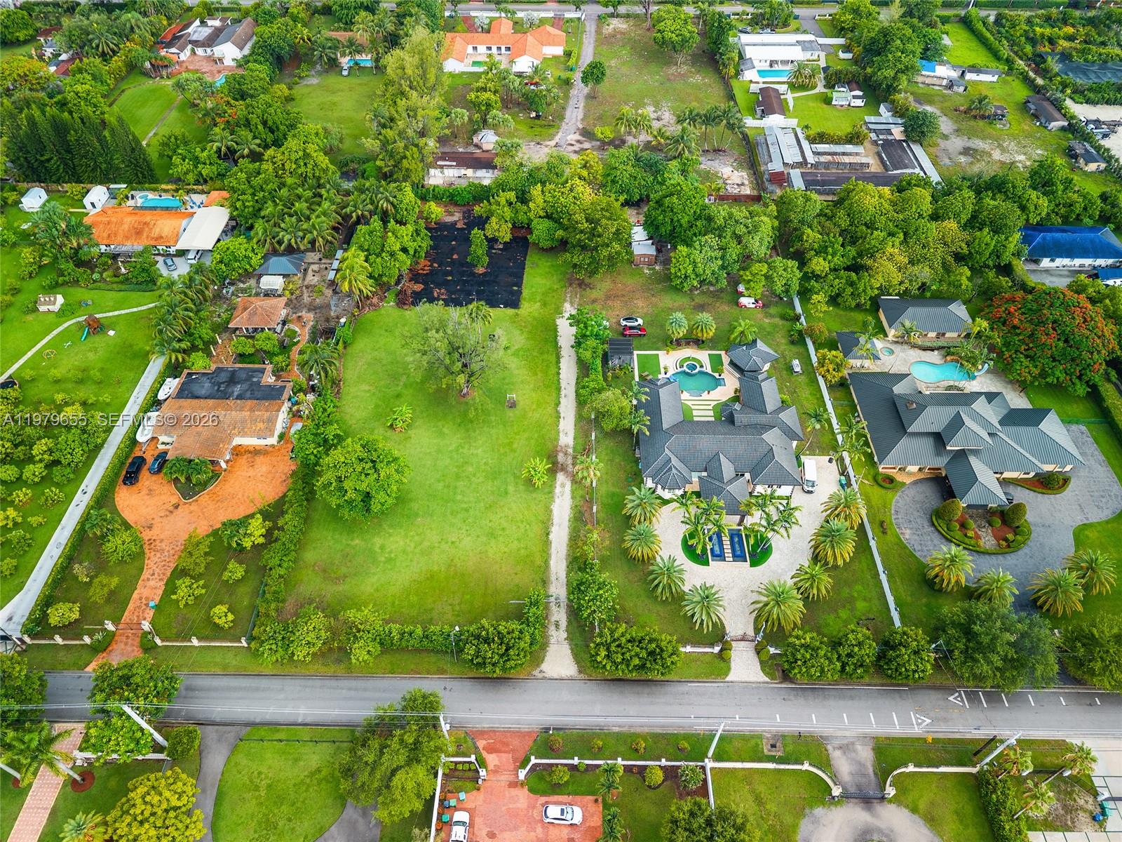 11950 Southwest 43rd Street Miami, FL 33175 - Photo 2 of 78 an aerial view of residential houses with outdoor space
