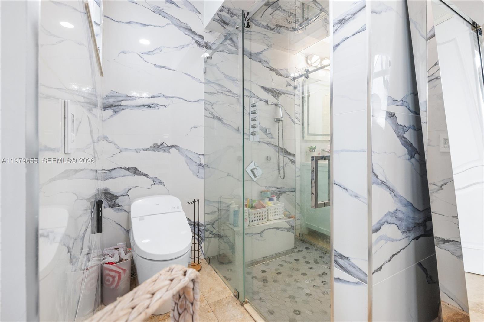 11950 Southwest 43rd Street Miami, FL 33175 - Photo 21 of 78 a white toilet sitting next to a bathroom sink