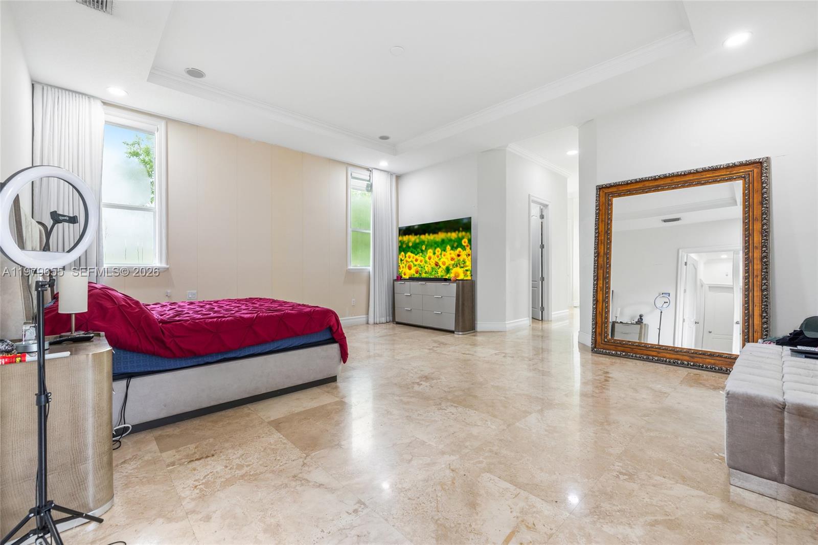 11950 Southwest 43rd Street Miami, FL 33175 - Photo 25 of 78 a bedroom with a bed and a chandelier