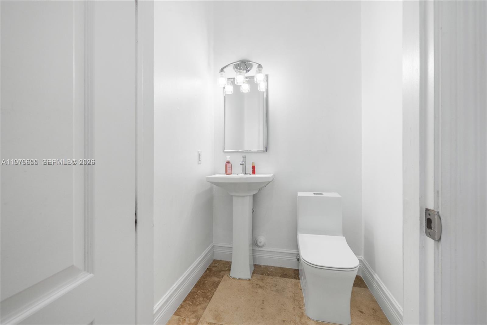 11950 Southwest 43rd Street Miami, FL 33175 - Photo 33 of 78 a bathroom with a sink and a toilet